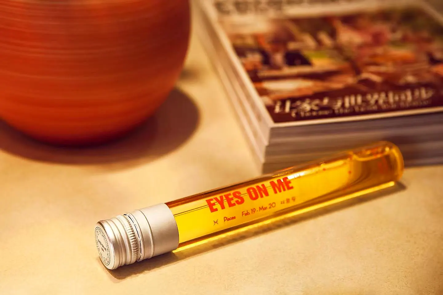 Real decorated glass tube bottle in a warm tabletop setting